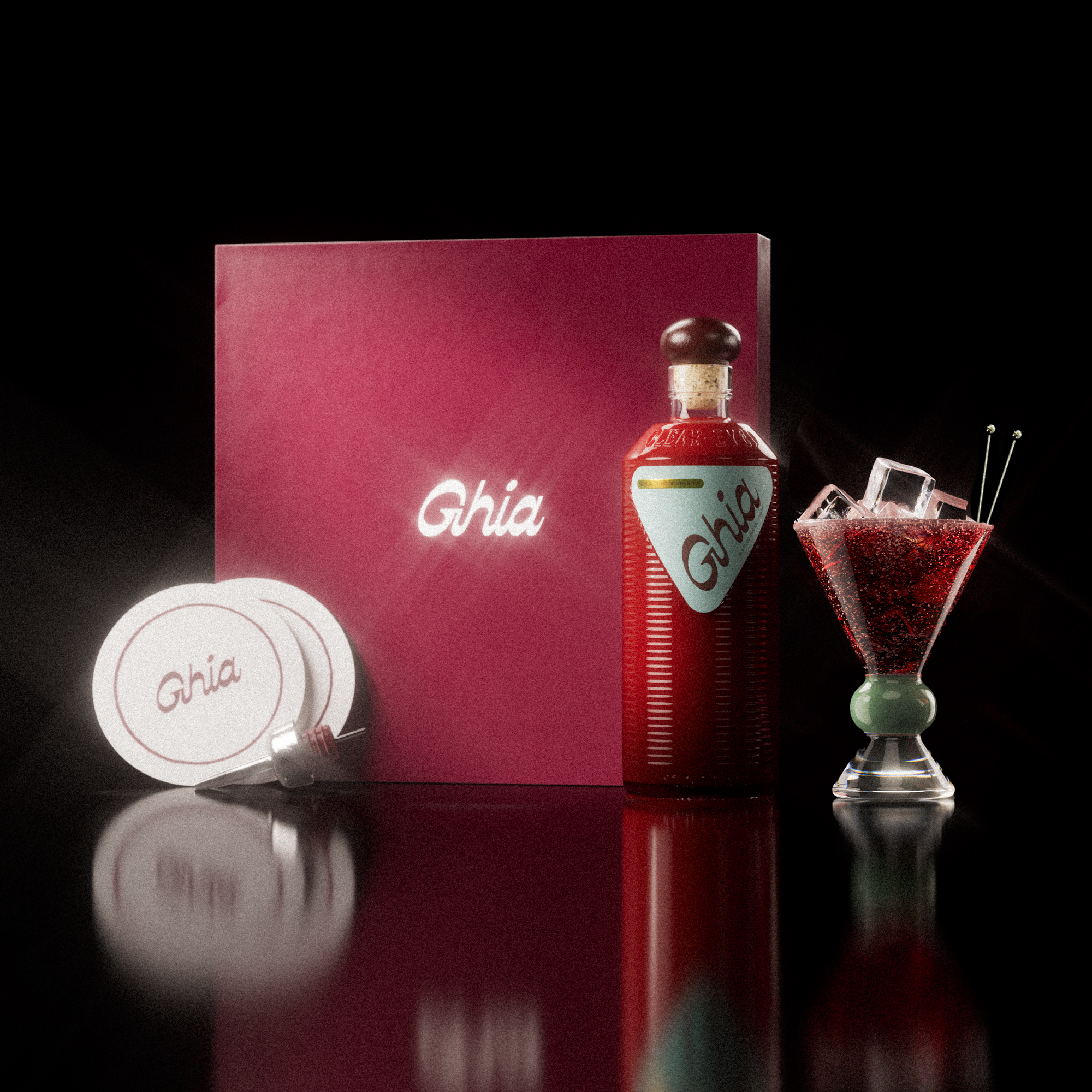 A Ghia non-alcoholic aperitif gift set with a burgundy box, paper coasters, 1 glass bottle of Original Apéritif, and a decorative cocktail glass that has a jade and clear base.